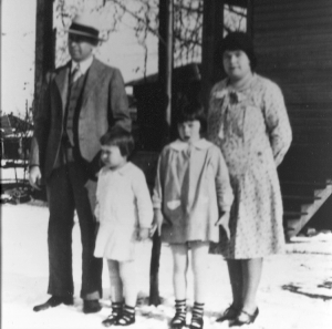Photo taken about 1930 of Wilson Van Buren Taylor, his wife Passie Louisa Witt, and their two daughters Mildred Louise Taylor and Virginia Van Taylor. Photograph is believed to have been taken outside their temporary home in Mount Pleasant, Texas